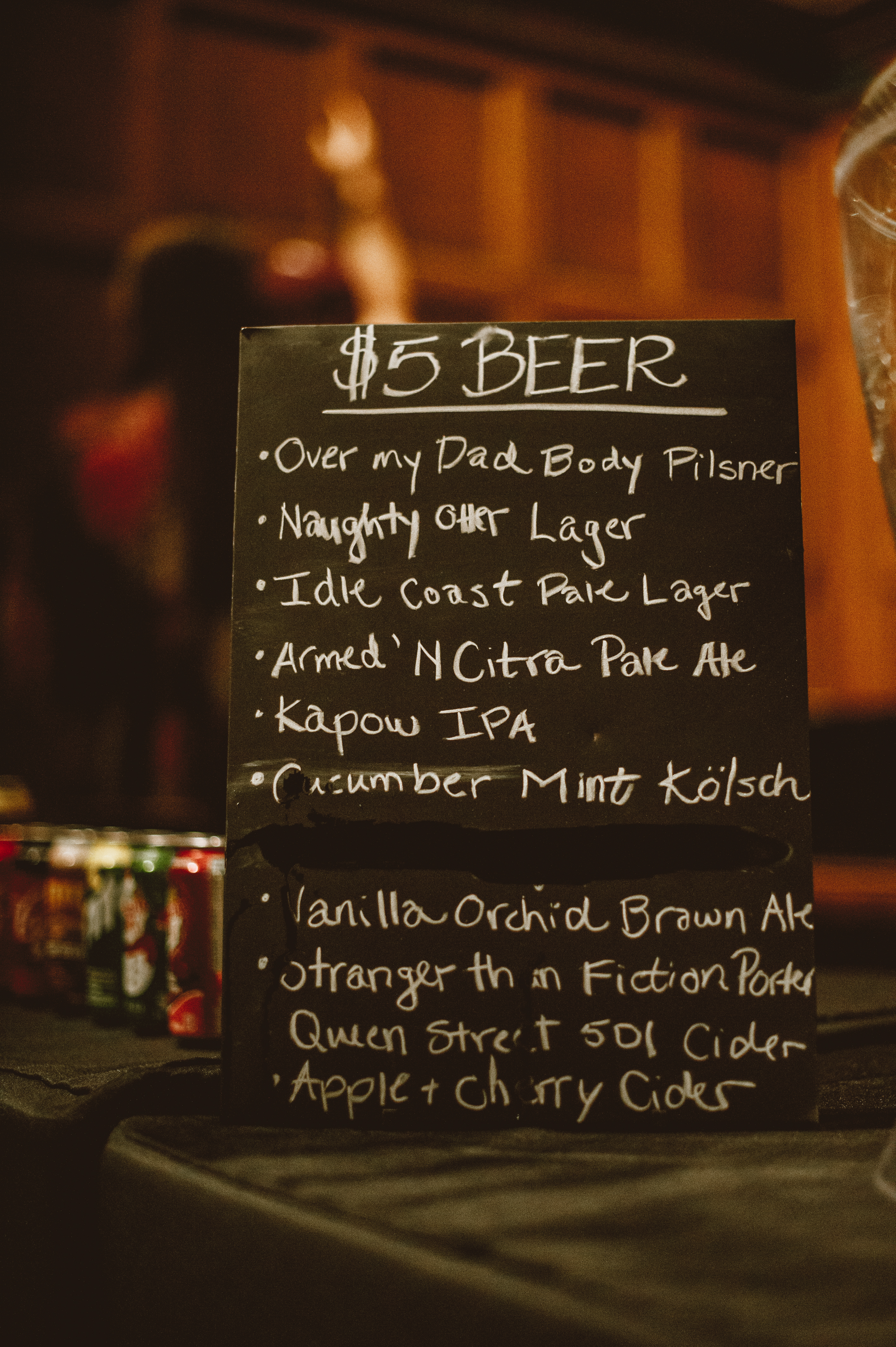 A chalk board sign showing the list of beer selections