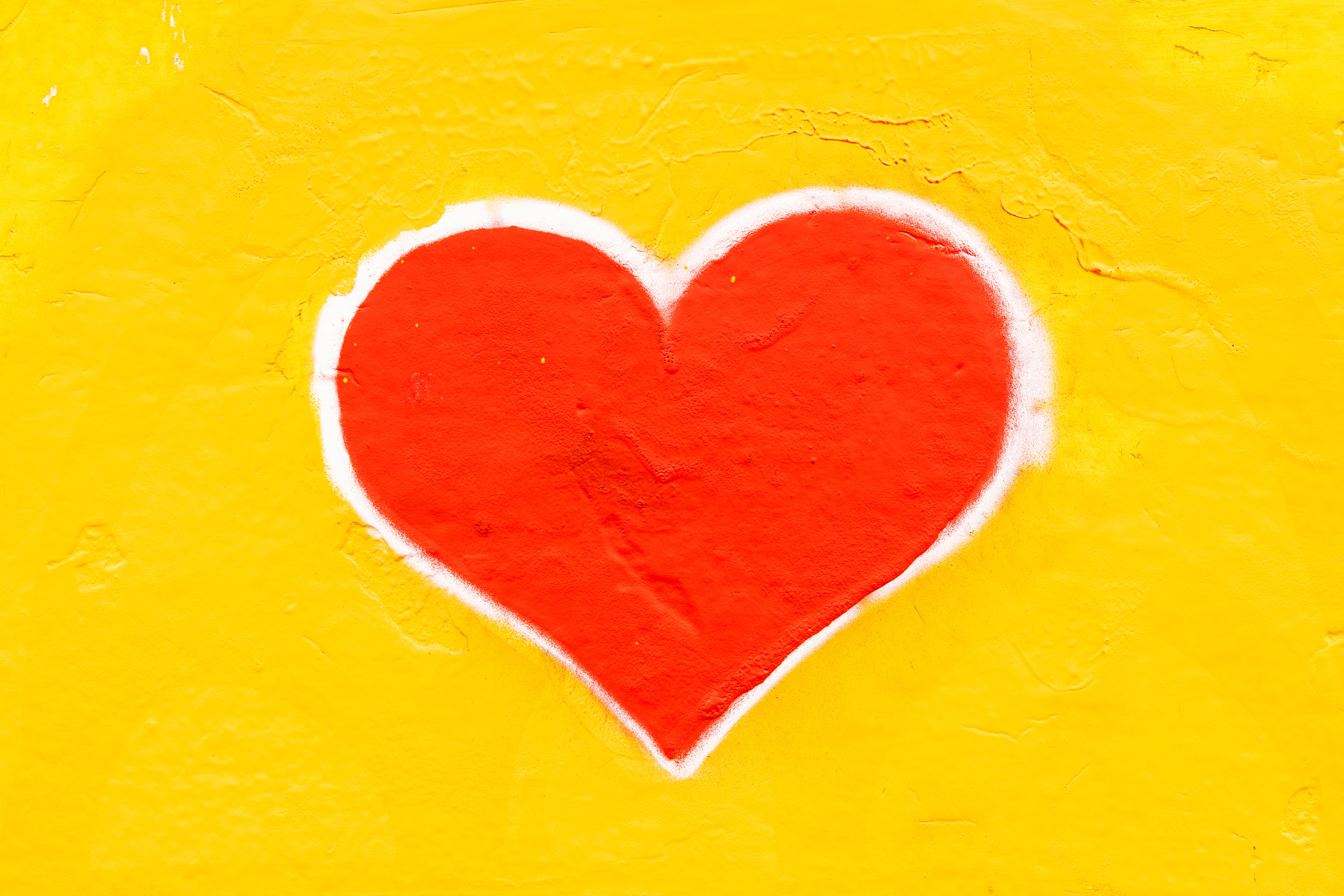 Red heart on yellow background Red heart on yellow background