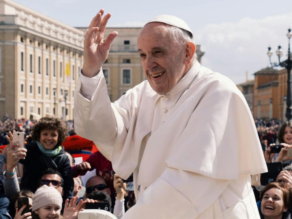 Pope Francis in open car travelling and greeting 