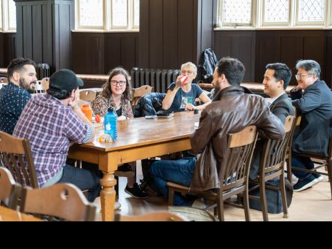 Wycliffe students talking around a table