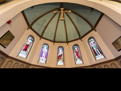 domed ceiling with hanging cross in Founders Chapel at Wycliffe College