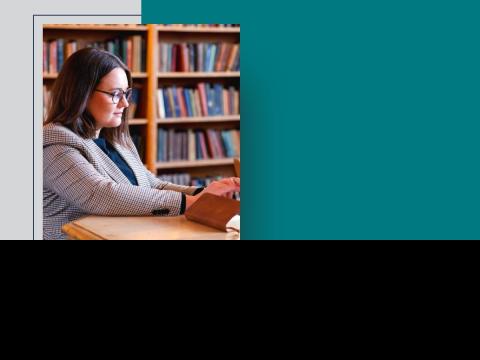 senior student Ellen Kelly in Cody Library typing on keyboard Jan 2025