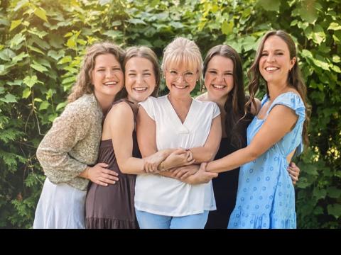 April McNeilly outdoors with her daughters 