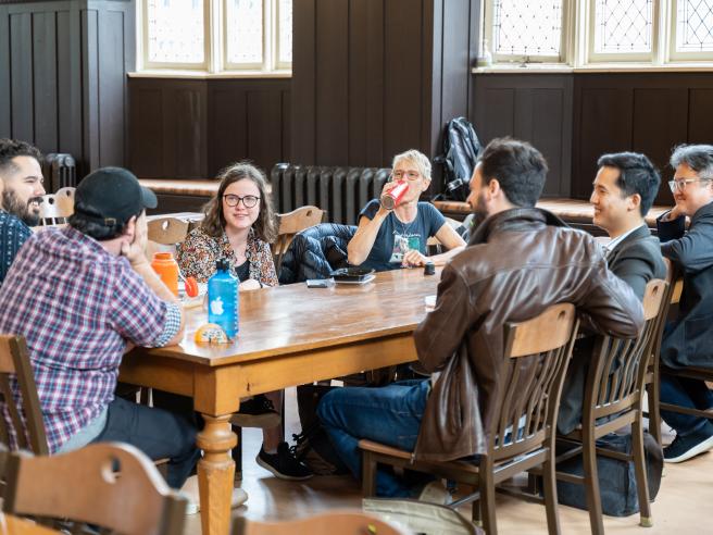 Wycliffe students talking around a table