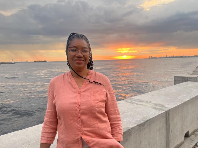 Myriam Dessables in peach linen top at sunset in Ephesus 