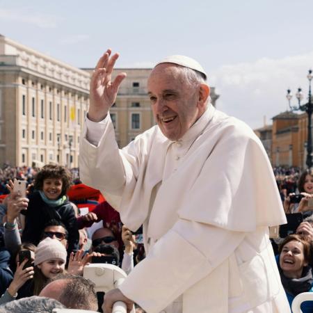 Pope Francis in open car travelling and greeting 