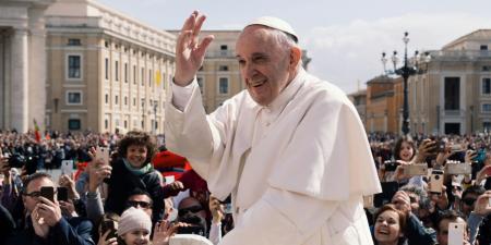 Pope Francis in open car travelling and greeting 