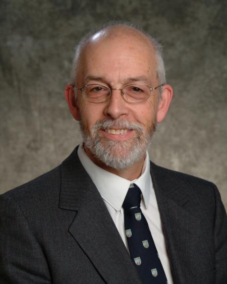 John Bowen dressed in suit and tie headshot 