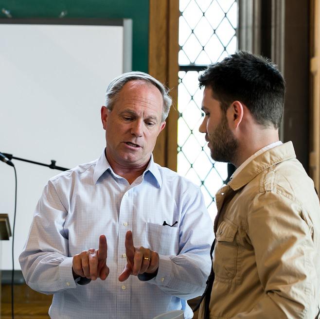 Chris Seitz speaking to a student