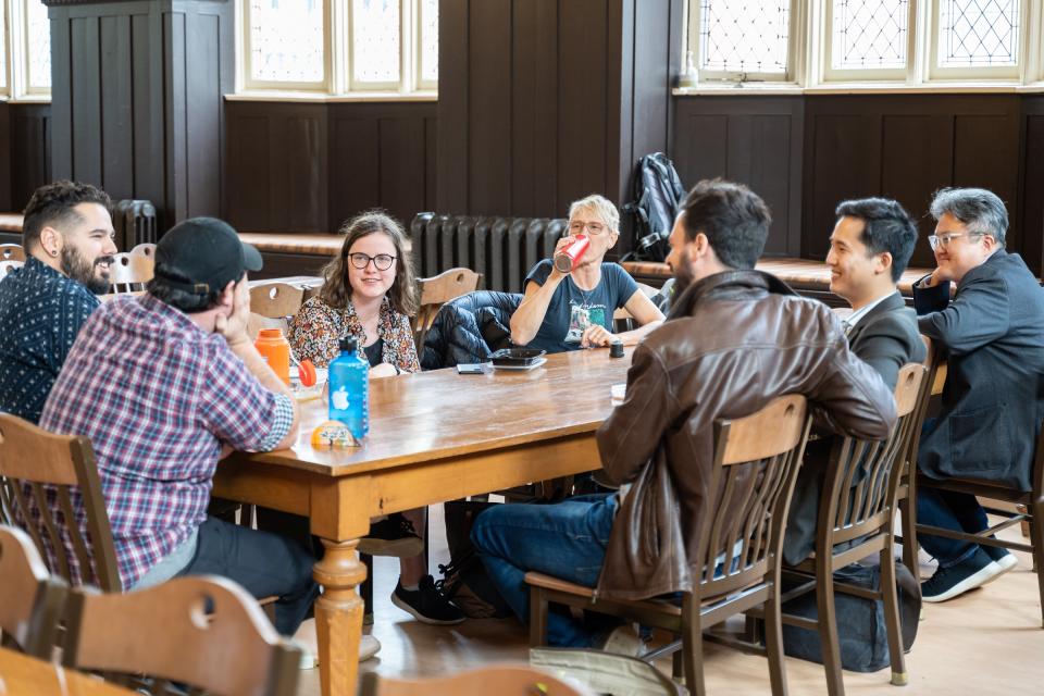 Wycliffe students talking around a table