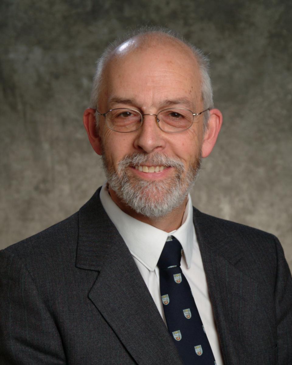 John Bowen dressed in suit and tie headshot 