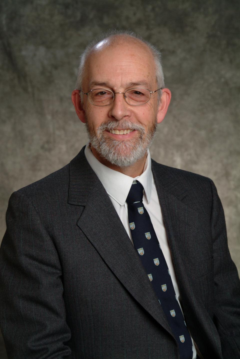 John Bowen dressed in suit and tie headshot 